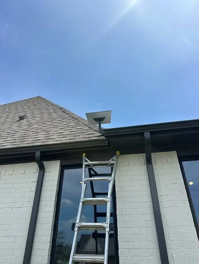 Starlink roof mount installation at the edge of a shingle roof on a brick home